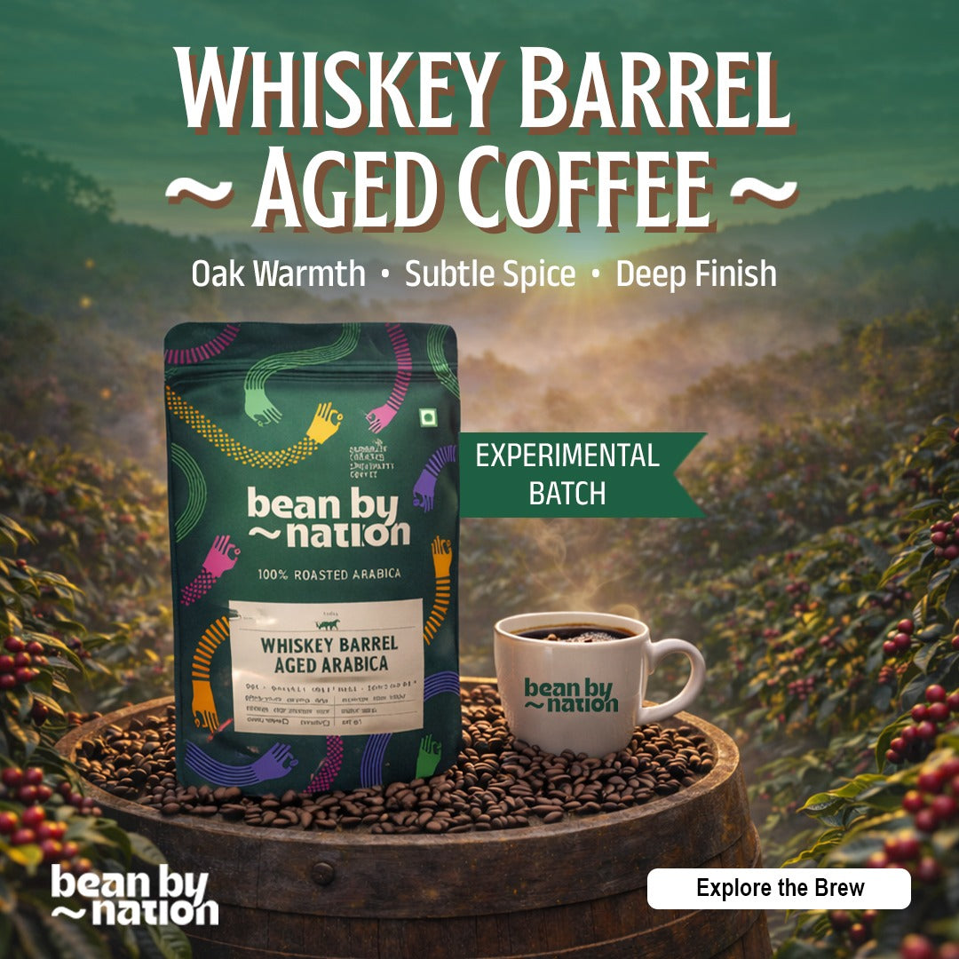 BeanByNation Whiskey Barrel Aged Coffee packaging on an oak barrel with coffee beans and branded mug – Experimental Batch