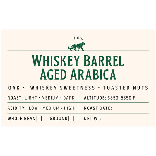 Whiskey barrel aged coffee whole beans close-up – oak infused Arabica